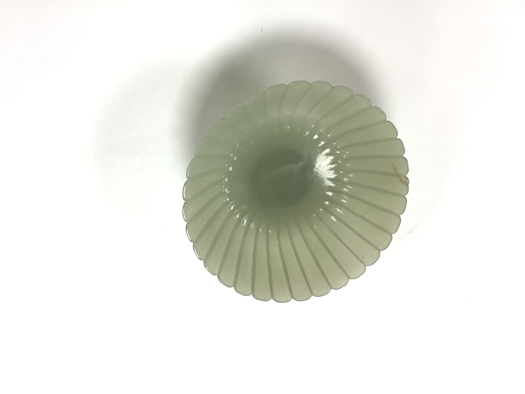 A fine Chinese Mughal style celadon jade ‘chrysanthemum’ bowl, 18th/19th century, 9.4cm diameter